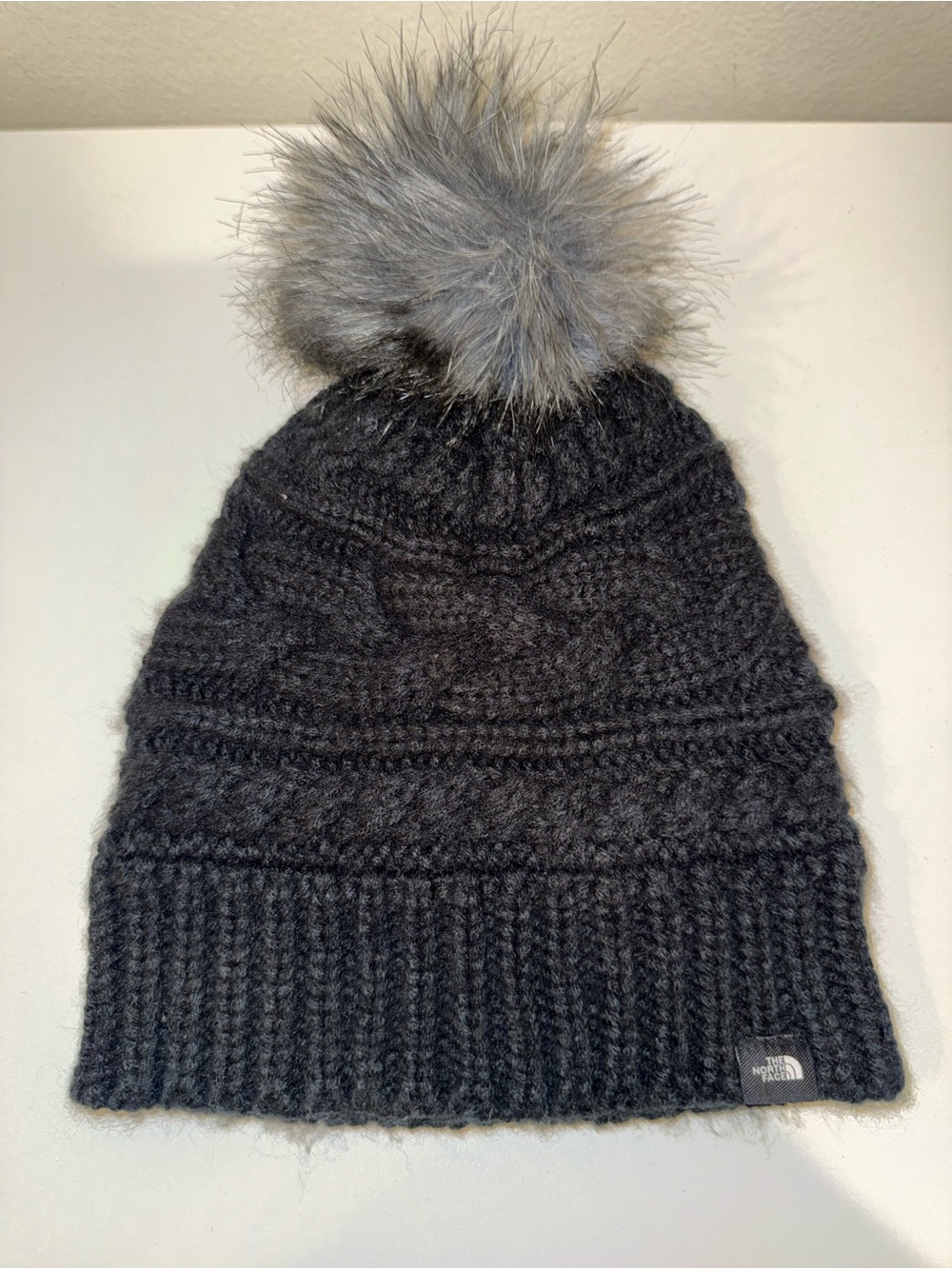 The North Face Black Knit Pom Beanie with Gray Faux Fur Pom